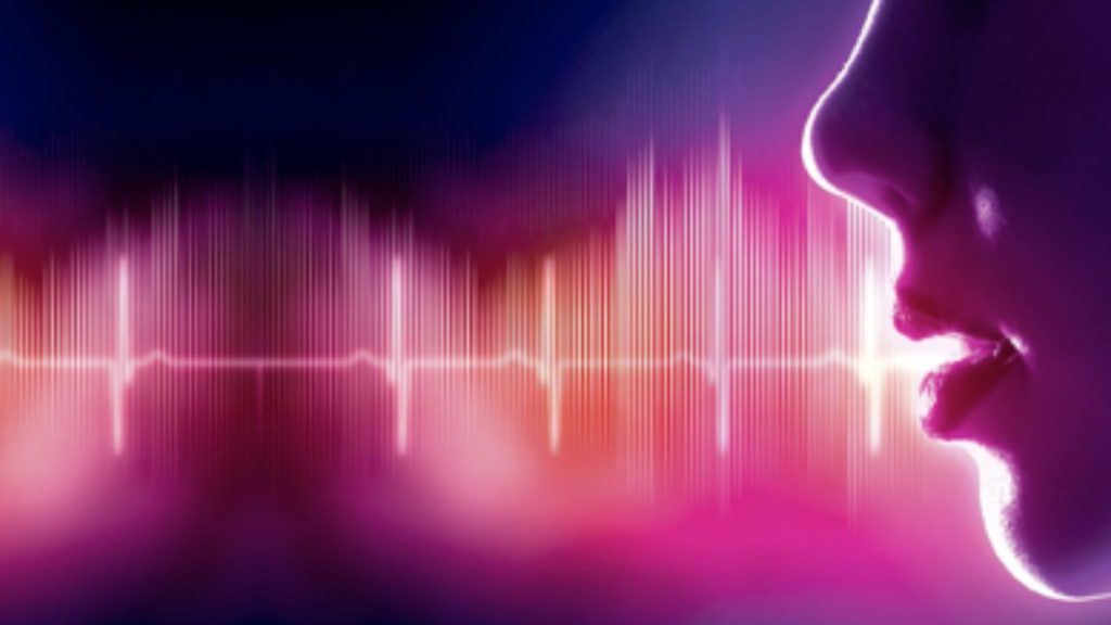 Un profilo femminile che emette un'onda sonora. In primo piano la mandibola, sede della lingua